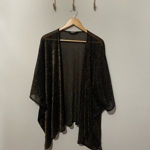 Dressed in Lala gold and black sheer sparkle coverup
